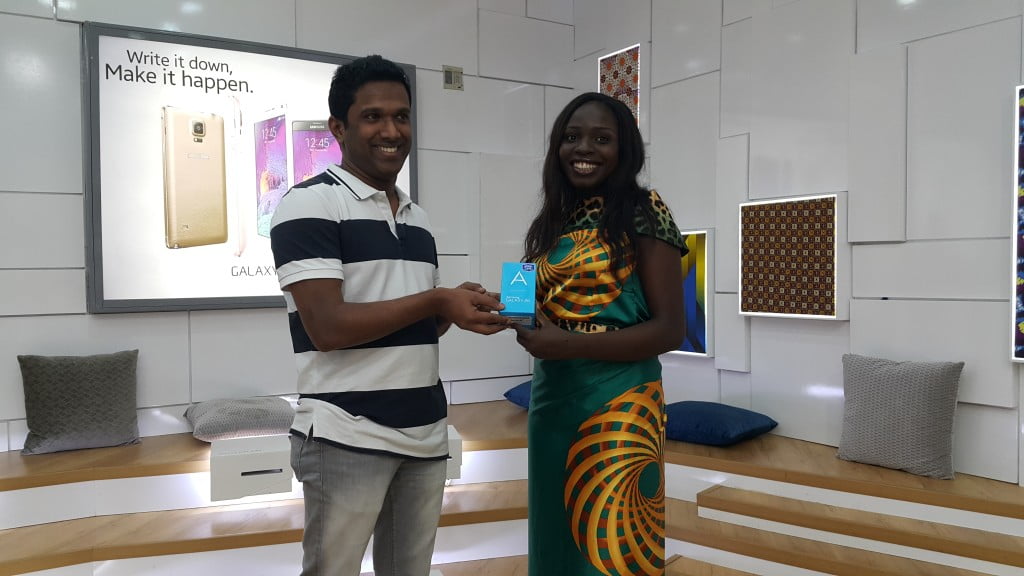 Lola Ichetaonye, winner of Samsung Galaxy A5 receives her prize from Product Manager - Mobile, Samsung Electronics West Africa